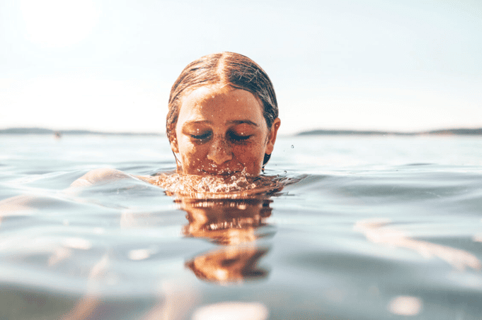 A person enjoying swimming in the water